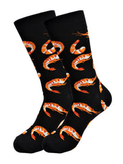 Black cotton Shrimp Socks with orange pattern worn on foot with gray pants and purple suede shoe
